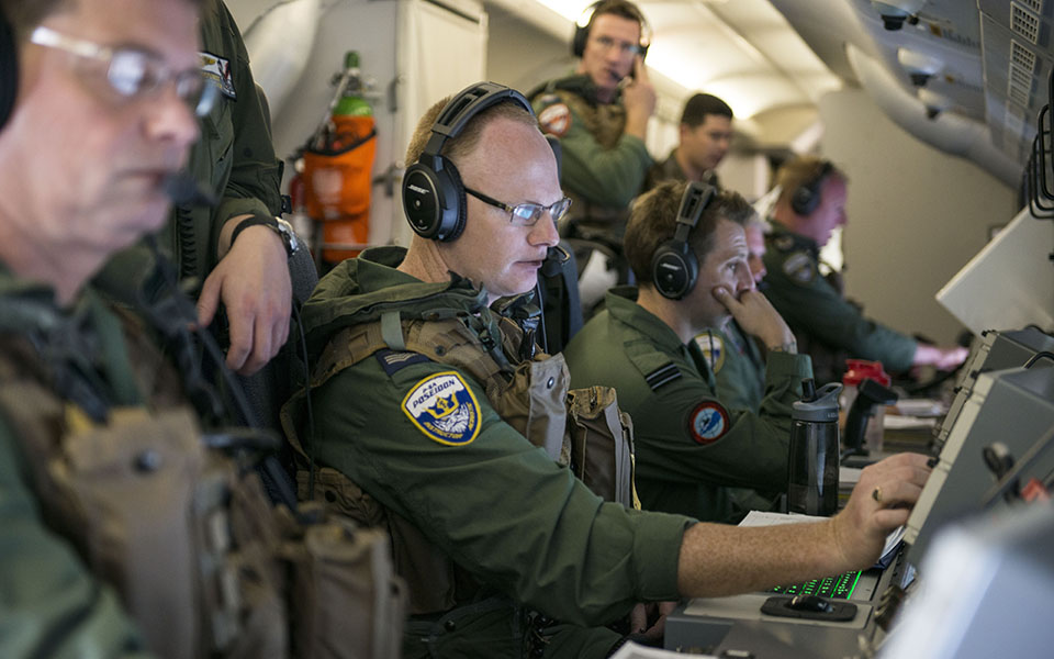 140407-N-CZ848-032  ATLANTIC OCEAN (April 7, 2014) Royal Air Force aircrewmen, assigned to the Pro’s Nest of Patrol Squadron (VP) 30, track a submarine from a P-8A Poseidon during Fleet Challenge 2014. The allied crew won the annual anti-submarine warfare competition, which put seven of the Navy’s best aircrews against each other in a simulator scenario and flight operations locating and tracking a submarine. (U.S. Navy photo by Mass Communication Specialist 3rd Class Jason Kofonow/Released)
